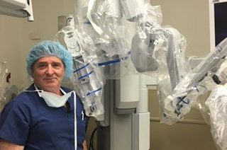 Dr. Reiner, NYC hernia surgeon with robotic arm
