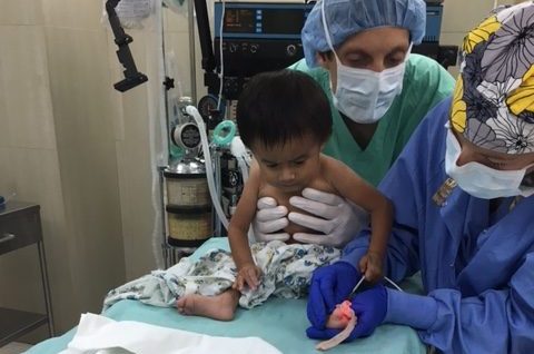 young child in Guatemala getting help from Dr. Reiner