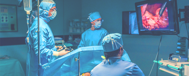 Doctors performing a laparoscopic hernia repair