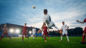 Soccer Player Receives Successful Pass and Kicks Ball to Score Amazing Goal doing Bicycle Kick.